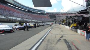 NASCAR Cup Series cars lined up on pit road at Bristol Motor Speedway before the race