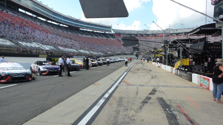 NASCAR Cup Series cars lined up on pit road at Bristol Motor Speedway before the race