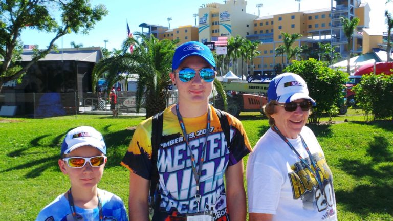 Family of race fans outside Homestead-Miami Speedway for Homestead NASCAR Ticket Packages weekend