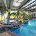 Indoor pool and tropical-style recreation area at the Hilton Knoxville Airport