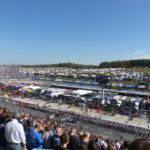 Fans fill the grandstands with full view of pit road and infield at Martinsville Speedway – Martinsville NASCAR Ticket Package with RaceAway Hospitality.