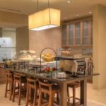 Breakfast buffet area at Hilton Garden Inn Pigeon Forge with fresh fruit, pastries, and modern seating