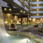 Indoor atrium lobby with fountain at Embassy Suites Kansas City International Airport
