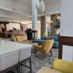 Modern hotel lobby with stylish seating area and front desk at a Bristol hotel for NASCAR weekend stays