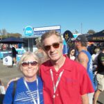 Couple enjoying the midway at Martinsville Speedway as part of a RaceAway Hospitality Martinsville NASCAR Ticket Package for race fans