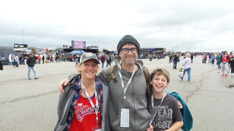 Race fans pose together in the fan zone at Kansas Speedway during a NASCAR weekend.
