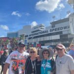 RaceAway Hospitality guests standing outside the main entrance of Daytona International Speedway on race weekend