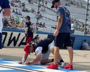 Nashville NASCAR ticket packages guest signing the track wall at Nashville Superspeedway