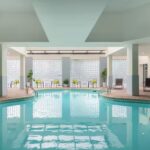 Indoor pool area at the Embassy Suites Charlotte hotel with lounge seating