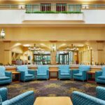 Comfortable lobby seating at Embassy Suites Greensboro for guests enjoying Martinsville NASCAR Packages