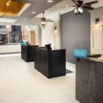 Embassy Suites Orlando North lobby with modern reception area, welcoming fans booking Daytona NASCAR Packages and Daytona NASCAR Tickets.