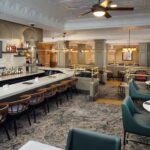 Embassy Suites Orlando North hotel bar and lounge with modern seating and full drink service.