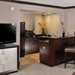 Spacious suite with TV and wet bar at Embassy Suites Des Moines Downtown