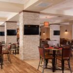 Hotel dining area at Embassy Suites Nashville Airport featured in Nashville NASCAR Ticket Packages