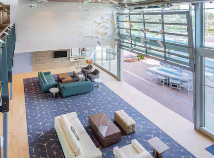 Aerial view of the Hampton Inn & Suites San Diego Airport Liberty Station lobby, included in San Diego NASCAR Packages.