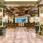 Elegant lobby with nature-inspired décor at Park MGM, featured in our October Las Vegas NASCAR Ticket Package.