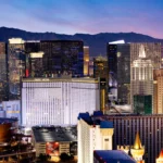 Skyline view of the Las Vegas Strip at dusk featuring Park MGM, a top choice for Las Vegas NASCAR Hotels.