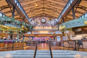 Dining and market-style food hall at Park MGM with vibrant lighting and casual seating.