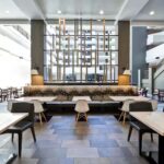 Bright dining area at Embassy Suites Charlotte for guests staying with Charlotte NASCAR Hotels