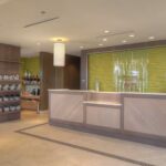 Front desk and bright lobby at the Hilton Garden Inn Pigeon Forge welcoming NASCAR guests.