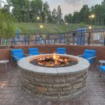 Outdoor firepit area with seating at the Hilton Garden Inn Pigeon Forge, part of our Bristol NASCAR Hotels.