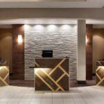 Front desk at Embassy Suites Phoenix – Tempe, welcoming guests as part of our Phoenix NASCAR Hotels.