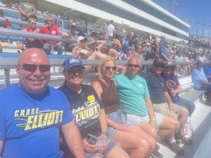 RaceAway guests sit together in the grandstands at Las Vegas Motor Speedway during a NASCAR race weekend.