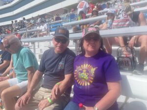 RaceAway guests sit in the grandstands at Las Vegas Motor Speedway during a NASCAR race weekend.