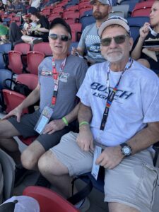 Two RaceAway guests sit in the grandstands at Phoenix Raceway during the 2026 Straight Talk Wireless 500.