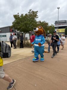 A costumed mascot walks through the fan area at Talladega Superspeedway during race weekend.