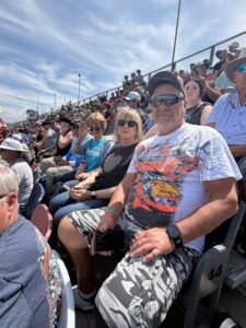 RaceAway guests sit together in the grandstands at Talladega Superspeedway during a NASCAR weekend.