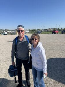 Two RaceAway guests pose for a photo outside Kansas Speedway during the 2026 AdventHealth 400 weekend.