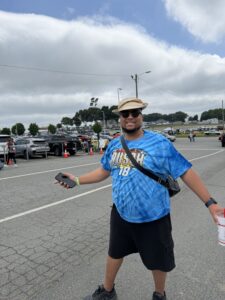 A RaceAway guest poses outside Charlotte Motor Speedway before the 2026 Coca-Cola 600 weekend festivities.