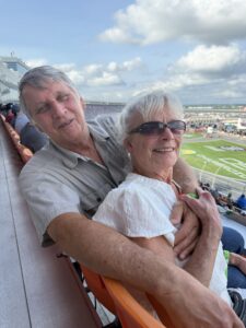 RaceAway guests lean together for a photo from the grandstands at Charlotte Motor Speedway during the 2026 Coca-Cola 600.