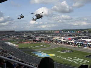 Two military helicopters fly over Charlotte Motor Speedway during pre-race ceremonies for the 2026 Coca-Cola 600.