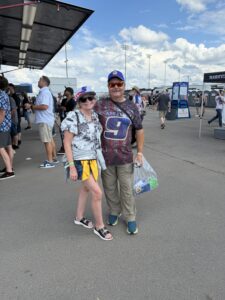 Two RaceAway guests pose in the fan area at Nashville Superspeedway during the 2026 Cracker Barrel 400 weekend.