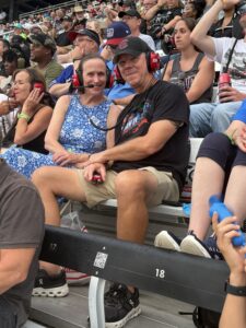 Two RaceAway guests smile from the grandstands at Nashville Superspeedway during the 2026 Cracker Barrel 400.