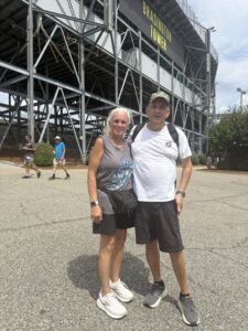 Two RaceAway guests pose beside Brasington Tower at Darlington Raceway during the 2026 Cook Out Southern 500 weekend.
