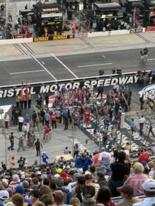 Fans watch pre-race activities near the start-finish line at Bristol Motor Speedway before the 2026 Bass Pro Shops Night Race.